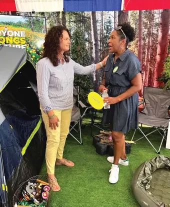  ?? PROVIDED PHOTOS ?? Natalie Phelps Finnie (above, left) — then the deputy director of the Illinois Department of Natural Resources — with Lt. Gov. Juliana Stratton and working the Governor’s Tent (left) at the Illinois State Fair.