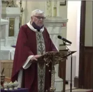  ?? FACEBOOK VIDEO SCREENSHOT ?? Father Paul Carey celebratin­g Mass on Ash Wednesday at St. Bernard’s Church in Waterville