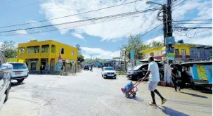  ?? ?? Once a thriving economic centre when the Long Pond Sugar Estates was the hub of sugar production in Trelawny, Clark’s Town has been in dire straits since the factory closed its door to sugar production in 2017.