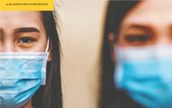  ?? EZRA ACAYAN / GETTY IMAGES ?? Filipino Catholics wearing masks attend Ash Wednesday services at a church in Manila’s Paranaque city on Wednesday. The country has only three confirmed cases of COVID-19.