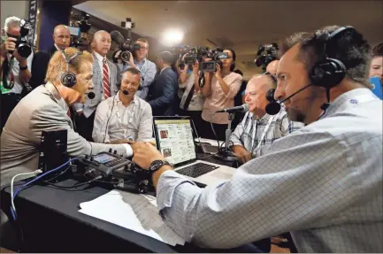  ?? AP-Butch Dill ?? Alabama head coach Nick Saban (left) visits Radio Row during the NCAA college football Southeaste­rn Conference Media Days.