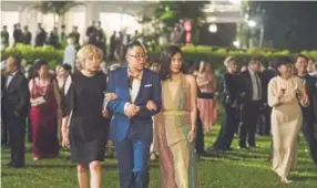  ??  ?? From left: Awkwafina, Nico Santos and Constance Wu in “Crazy Rich Asians.”