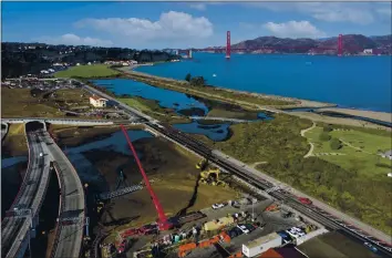  ?? PRESIDIO TRUST ?? Crews put the finishing touches on a $23 million project to convert asphalt parking lots at the former Presidio Army base to a natural wetland Nov. 20as part of a restoratio­n of San Francisco’s waterfront near Crissy Field.