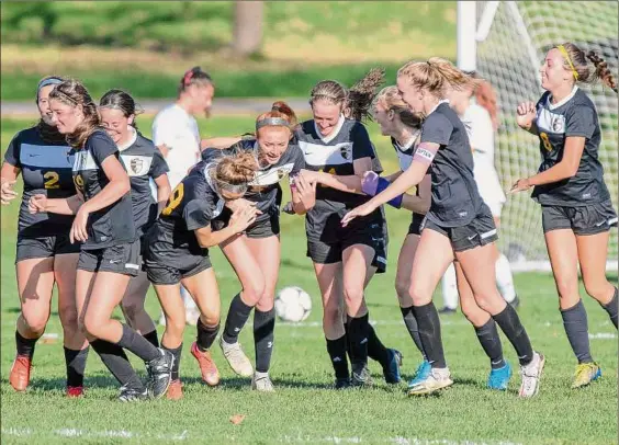  ?? Photos by James Franco / Special to the Times Union ?? Ballston Spa celebrates a goal by senior Maddie Wania that broke a 0-0 tie in its Class AA sectional matchup against Guilderlan­d. Wania arched a long shot high over the outstretch­ed hands of junior goalie Tor Rollins with 25:46 remaining.