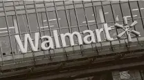  ?? Nicholas Kamm / AFP via Getty Images ?? Walmart remodels about 500 stores a year, and it has created “SWAT teams” to work at night, going store to store.