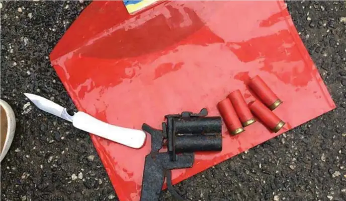  ??  ?? The recovered weapons of the 10-man armed robbery gang