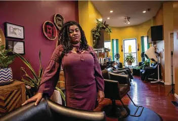  ?? Andre Chung / New York Times ?? Yasmine Young, owner of Diaspora Salon, poses at her salon in Baltimore recently. Young is among the thousands of minority small-business owners struggling in the wake of the coronaviru­s pandemic.