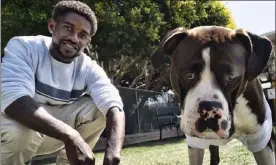  ?? Ap ?? ro mantooth plays with his dog, champ, at a dog park with the nonprofit people assisting the Homeless, in the Venice section of los angeles on april 5. it was the first facility of its kind in los angeles county to allow homeless shelter residents to bring animal companions. ‘He's really my best friend. i don't know what i'd do without him,' mantooth, 29, said of champ. ‘i'm lucky to have him. not a lot of places are going to take animals, you know.'