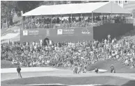  ?? COURANT FILE ?? A welcome site for the 2021 Travelers Championsh­ip will be the return of the fans, like this around the 15th green each year.