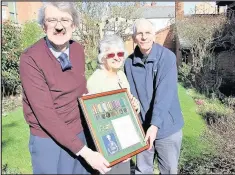  ??  ?? From left, medal collector Stephen Kellaway presented replicas of medals awarded to Hinckley Boer War and First World War veteran Sharrad Gilbert to Ann Crabtree and Phillip Lindley for display at Hinckley and District Museum