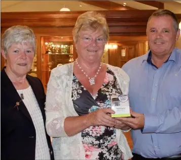  ??  ?? Courtown lady Captain Laura Funge, Eleanor Kelly (winner) and John Coone, club profession­al (sponsor).