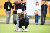  ?? (AFP) ?? England’s Tommy Fleetwood sets up a shot on the greens during a practice session at The Open on Monday.