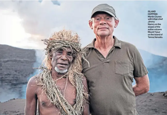  ?? ?? ISLAND HOPPING: Martin Clunes with tribal chief Jimmy Namry on the slopes of the active volcano Mount Yasur on the island of Tanna,Vanuatu.
