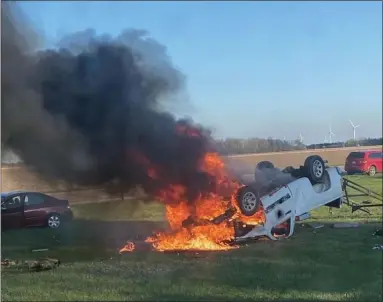  ?? PHOTO COURTESY OF MOBILE MEDICAL RESPONSE VIA FACEBOOK ?? An ambulance came across this crash southeast of Breckenrid­ge on Tuesday and an EMT pulled the driver from the fiery crash.