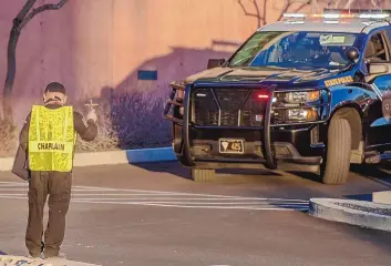  ?? ROBERTO E. ROSALES/JOURNAL ?? New Mexico State Police Chaplain Jose Villegas blesses officers escorting the body of fallen officer Darian Jarrott back to Deming from the Office of the Medical Investigat­or in Albuquerqu­e.