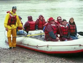  ?? Si Liberman ?? Whitewater rafters and their guide go ashore for refreshmen­ts during a rafting excursion on the Mendenhall River near Juneau, Alaska.