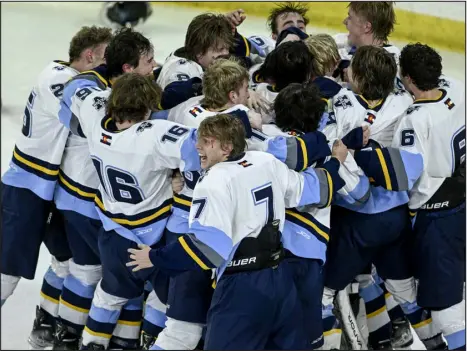  ?? AARON ONTIVEROZ — THE DENVER POST ?? Valor Christian’s Aiden Owen (7) joins his teammates to celebrate their 7-3 win over Ralston Valley to capture the Colorado Class 5A state hockey championsh­ip on Tuesday night at the University of Denver’s Magness Arena.