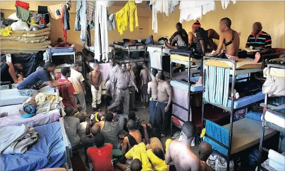  ?? Picture: BRENTON GEACH ?? TOO CLOSE FOR COMFORT: Prisoners live in overcrowde­d cells in Pollsmoor Prison. Some inmates have been awaiting trial for eight years.