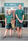  ?? DOMINICO ZAPATA / FAIRFAXNZ ?? Neve Ganley, left, and Chelsey Whakaari, both 12, attend Mt Maunganui Intermedia­te School, which is at the forefront of a trend to get rid of skirts and dresses entirely – uniforms increasing­ly are trousers/shorts or, sometimes, culottes/skorts.