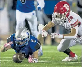  ?? Timothy Hurst / Staff Photograph­er ?? Broomfield’s Blake Naranjo, left, jumps on a loose ball before Brighton running back Vershon Brooks can get it Friday night in Broomfield.