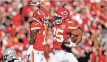  ?? JAY BIGGERSTAF­F / USA TODAY ?? Chiefs running back Clyde Edwards-Helaire (right) celebrates with receiver Tyreek Hill during Kansas City’s win on Sunday.