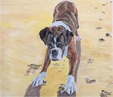  ??  ?? Playtime at the beach Ally’s beloved boxer dog Mishka