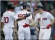  ?? MICHAEL DWYER—ASSOCIATED PRESS ?? Boston Red Sox’s Brock Holt, right, celebrates his two-run home run that also drove in Tzu-Wei Lin (30) during the ninth inning of a baseball game against the New York Yankees in Boston, Saturday, Sept. 29.