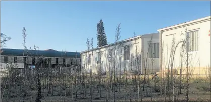  ?? Picture: INGANATHI WILLIAMS ?? VACANT: The prefab structures opposite Cambridge police station are yet to be put to use