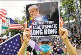  ?? Miguel Candela EPA/Shuttersto­ck ?? A PRO-DEMOCRACY rally in Hong Kong. President Trump has not acknowledg­ed that the protesters have legitimate complaints about political repression.