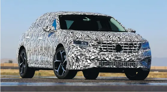  ?? DEREK MCNAUGHTON ?? The 2020 Volkswagen Passat, wrapped here in camouflage, features available rain-sensing wipers, adaptive cruise control, ambient lighting and lane assist.