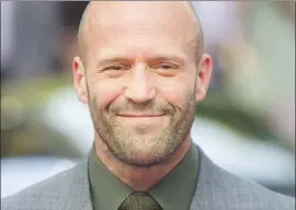  ?? Samir Hussein WireImage ?? THE ‘#JUSTICE for Han” contingent say a villainous act by Jason Statham’s Deckard Shaw in “Fast & Furious 6” needs to be addressed in the series, and soon.