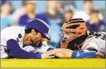  ?? Associated Press ?? Marcio Jose Sanchez
CHRIS TAYLOR, left, and the Dodgers battled Buster Posey and the Giants to the wire.