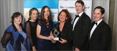  ??  ?? The Highlanes Team accept the Sport, Art and Culture Award from Helen Bennett from Irish Cement at the 2017 Awards at the City North