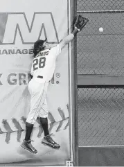  ?? Karen Warren / Houston Chronicle ?? Astros left fielder Colby Rasmus is unable to make the catch on this two-run double by the Angels’ David Freese in the eighth inning Wednesday.