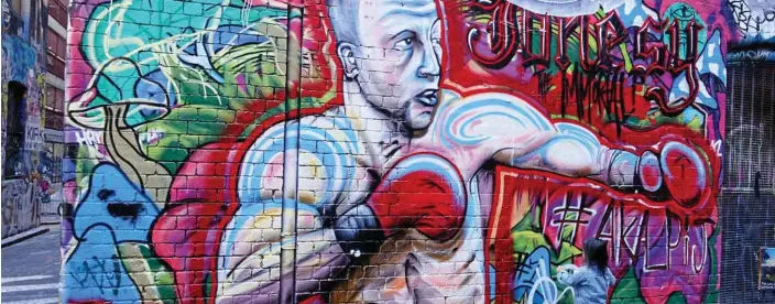  ??  ?? The street art in Melbourne's laneways is a big tourist attraction, and (below) Ann Rickard enjoys the rooftop terrace at Fraser Place in Melbourne. PHOTOS: GEOFF RICKARD