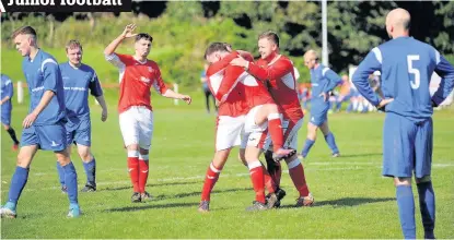  ??  ?? Party time Scott Arthur is mobbed following yet another goal for the Keanie Park side