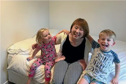  ?? SUPPLIED ?? Alexandra and Leo Nicholas make themselves comfortabl­e in homestay Chinatsu Ishikawa’s bedroom.