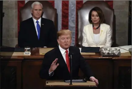  ?? OLIVIER DOULIERY/ABACA PRESS/TRIBUNE NEWS SERVICE ?? President Donald Trump delivers his State of the Union address to a joint session of Congress on Capitol Hill in Washington, D.C., on Tuesday. Vice President Mike Pence and Speaker of the House Nancy Pelosi look on while seated behind him.