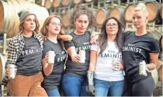  ?? DAVID L. REAMER ?? Young women hold cans of Union Wine Co.'s Get It Girl line of wines, which raises money for Planned Parenthood, in a promotiona­l photo.