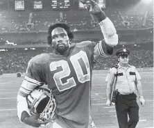  ?? Paul Jasienski / Associated Press 1981 ?? Lions running back Billy Sims waves to fans after Detroit’s opening win over the 49ers in 1981. The Lions finished 8-8.