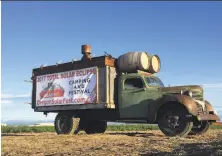  ?? Gillian Flaccus / Associated Press ?? An ad for a festival built around the Aug. 21 solar eclipse sits alongside a busy road leading into Madras, Ore. The state is expecting up to 1 million visitors.