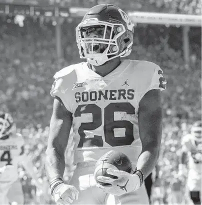  ?? JEFFREY MCWHORTER/AP ?? Oklahoma running back Kennedy Brooks celebrates a fourth-quarter touchdown against Texas on Saturday in Dallas.