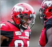  ?? JEFF MCINTOSH — THE CANADIAN PRESS VIA AP ?? Calgary’s Kamar Jorden, left, celebrates his touchdown against the Montreal Alouettes during a game in 2018.