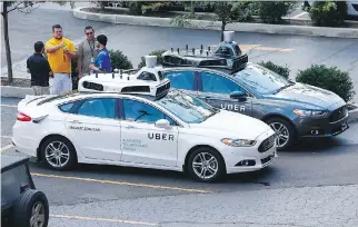  ?? JARED WICKERHAM/THE ASSOCIATED PRESS ?? Internal documents found Uber’s fleet of self-driving cars drove almost 32,000 kilometres last year. In almost every one of those kilometres, a human needed to take the wheel.