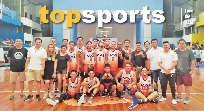  ?? AXEL MAY CLAPANO PHOTO ?? CHAMPS AT LAST. The VXI Global team and management pose after finally ending their title-drought by posting a 50-33 victory over Awesome OS in the Davao Inter-BPO League (DIBL) 2018 basketball tournament championsh­ip yesterday at the Rizal Memorial...