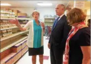  ?? EVAN BRANDT — DIGITAL FIRST MEDIA ?? Barbara Wilhelmy, left, executive director of the Cluster Outreach Food Pantry in Pottstown, gives U.S. Sen. Bob Casey a tour of the facility before he departed for Washington, D.C., to vote on the Senate’s farm bill.