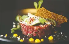  ??  ?? Tartare (bison or beet) with 64 egg, flax tulip, horse radish and watercress.