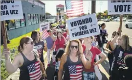  ?? Kent Nishimura Los Angeles Times ?? VOTERS serenaded by a mariachi band march to cast their ballots in Whittier. Latinos, young people and urbanites gave Bernie Sanders a big boost in the West.