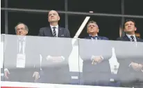  ?? DAVID VINCENT/ASSOCIATED PRESS ?? FIFA President Gianni Infantino, second from left, attends the pre-match show for Friday’s quarterfin­al match between Uruguay and France at the World Cup in Nizhny Novgorod, Russia. Infantino wants to add 16 teams to the tournament.