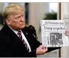  ?? YURI GRIPAS / ABACA PRESS ?? President Donald Trump held up newspapers with banner “ACQUITTED” headlines during an annual prayer breakfast Thursday.